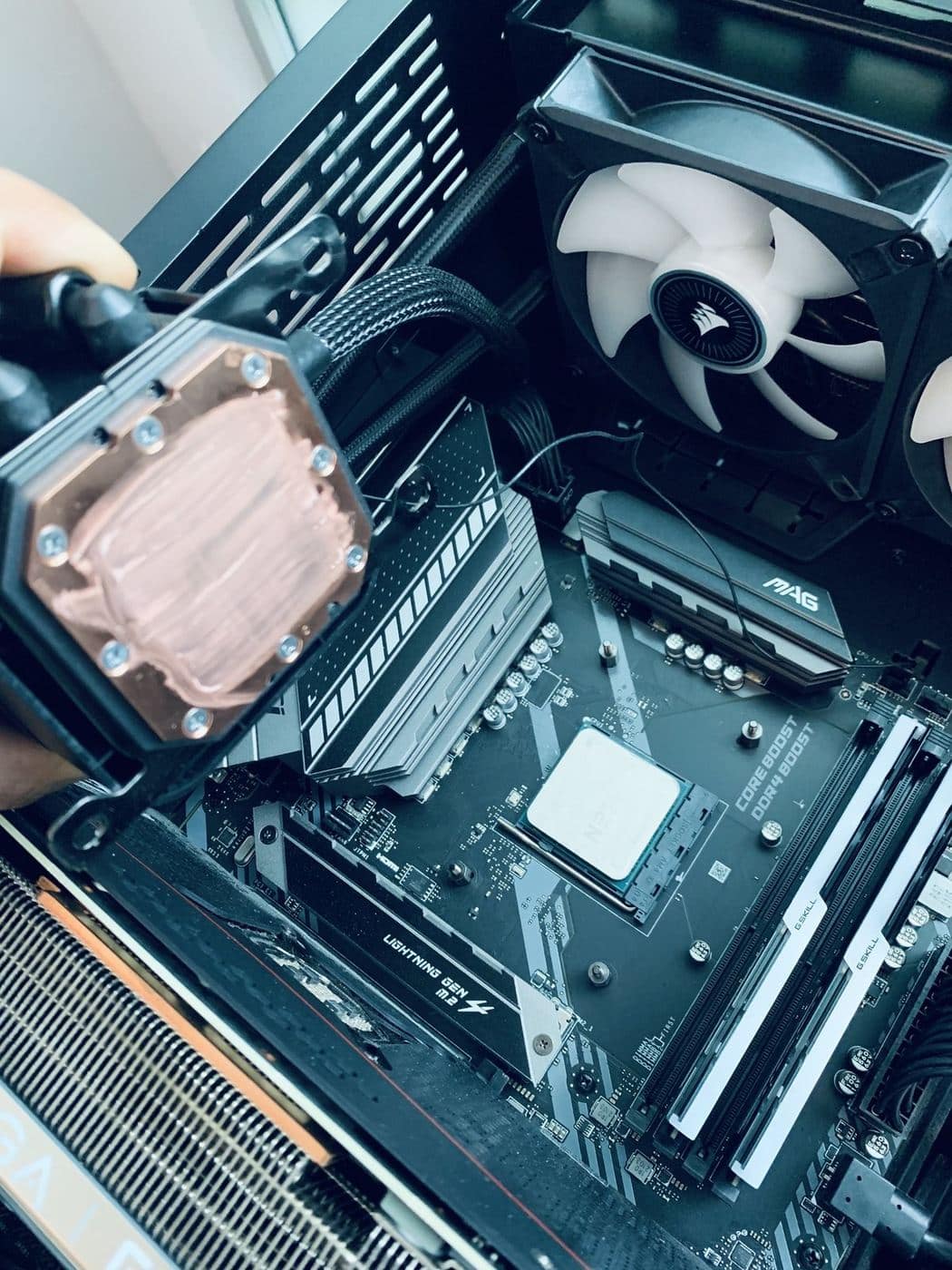 GeekzUP technician installing a CPU cooler during a repair